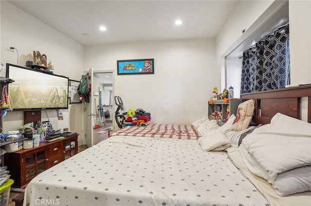 bedroom with hardwood / wood-style floors