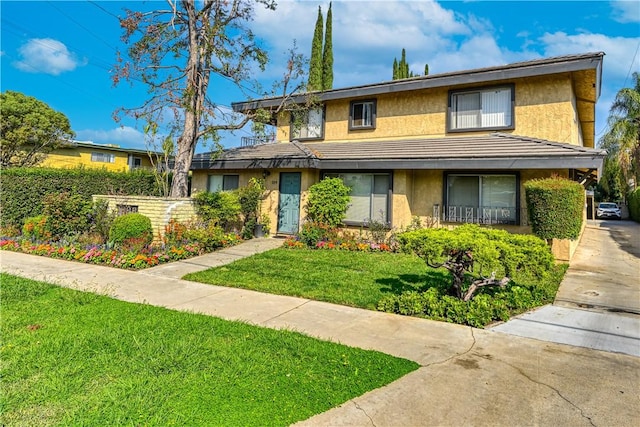 view of front of home with a front lawn