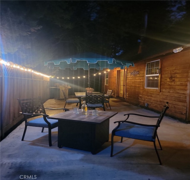 patio at twilight with a fire pit