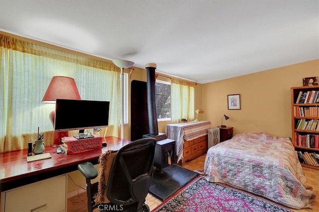 bedroom with light hardwood / wood-style flooring