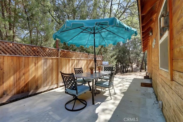 12828 Broyles Trl, Oregon House, CA 95962 - view of patio featuring outdoor dining area and view of scattered trees