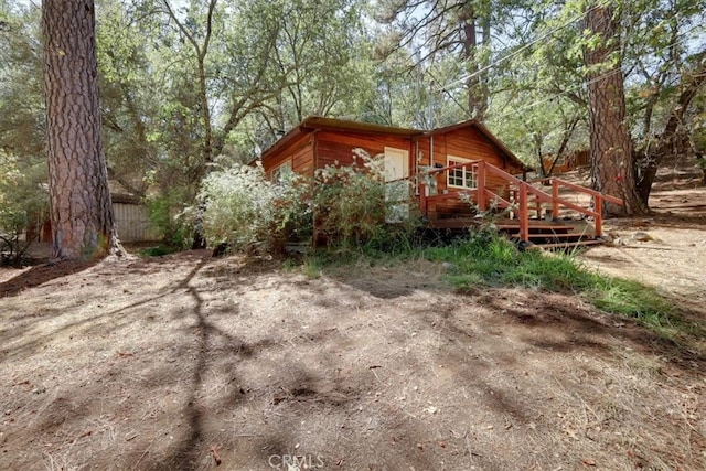 exterior space featuring a wooden deck