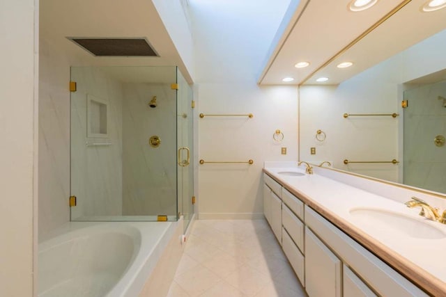 bathroom featuring vanity, shower with separate bathtub, and tile patterned flooring