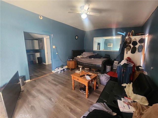 living room with hardwood / wood-style floors and ceiling fan