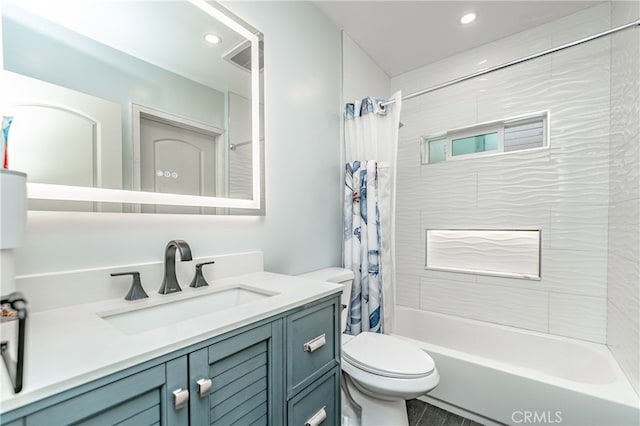 full bathroom featuring vanity, toilet, and shower / bath combo