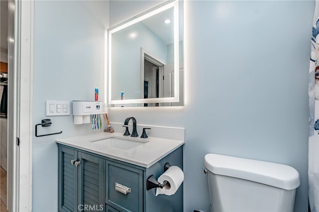 bathroom with vanity and toilet