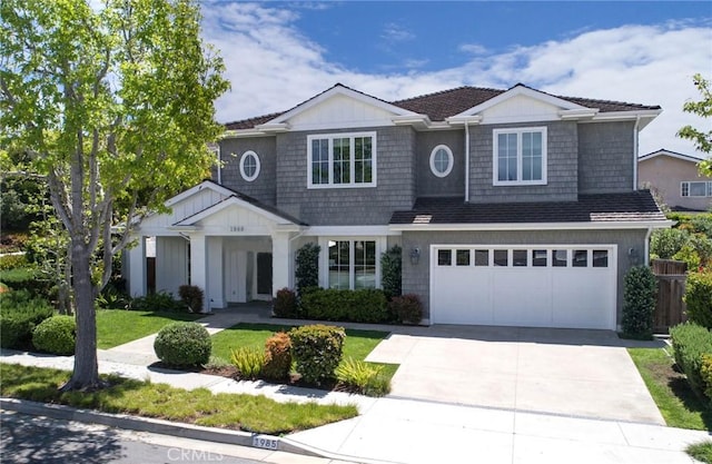 view of front of house with a front lawn and a garage