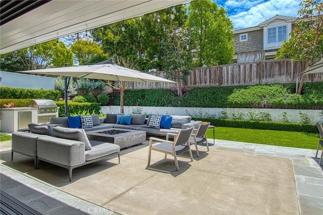 view of patio featuring an outdoor living space with a fire pit and area for grilling