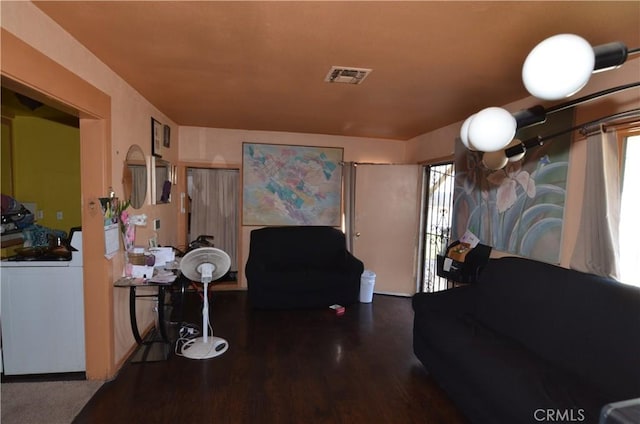 14407 S Corlett Ave, Compton, CA 90220 - living area with healthy amount of natural light, wood finished floors, and washer / clothes dryer