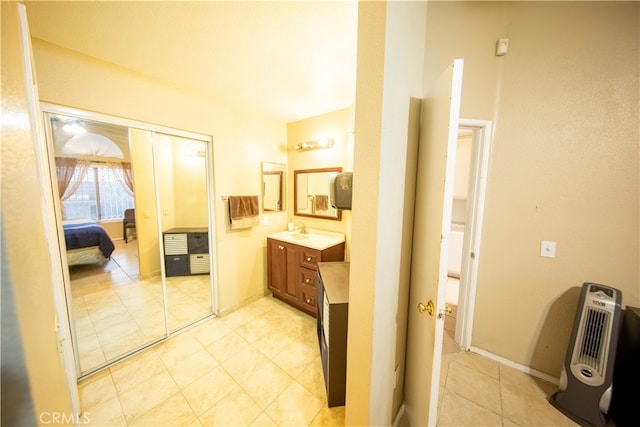 bathroom featuring vanity and heating unit