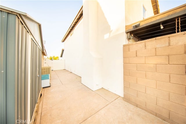 view of side of property featuring a patio area