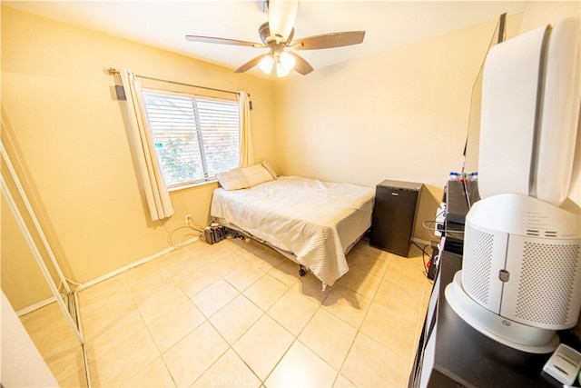 tiled bedroom with ceiling fan