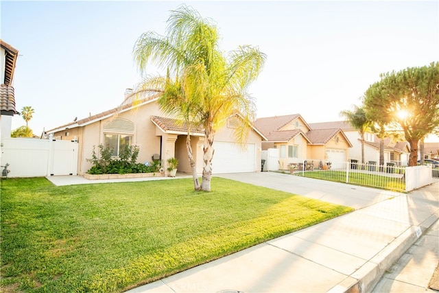 view of front of house with a front lawn and a garage