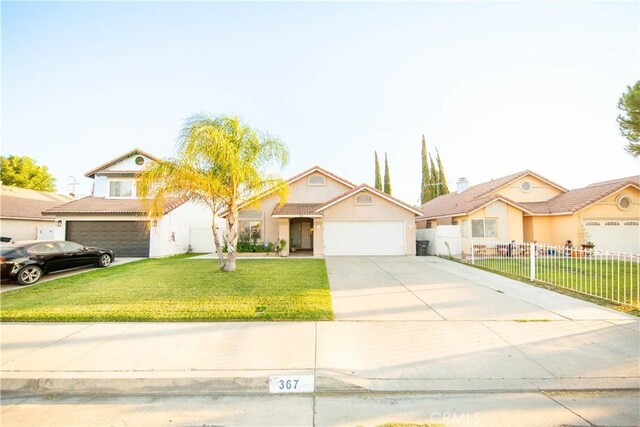 view of front of property with a front lawn and a garage