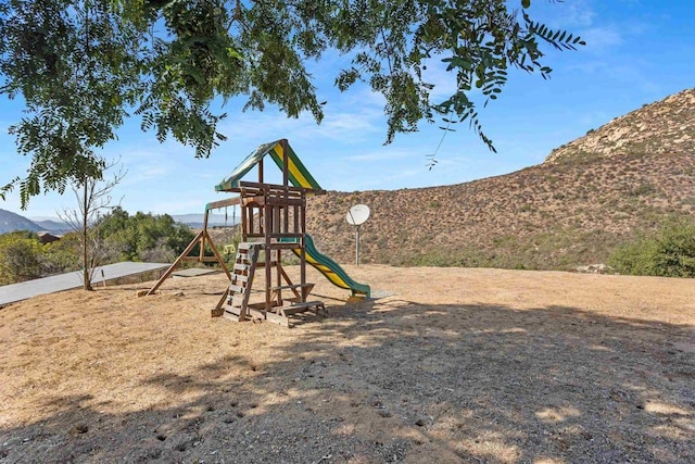 view of play area featuring a mountain view