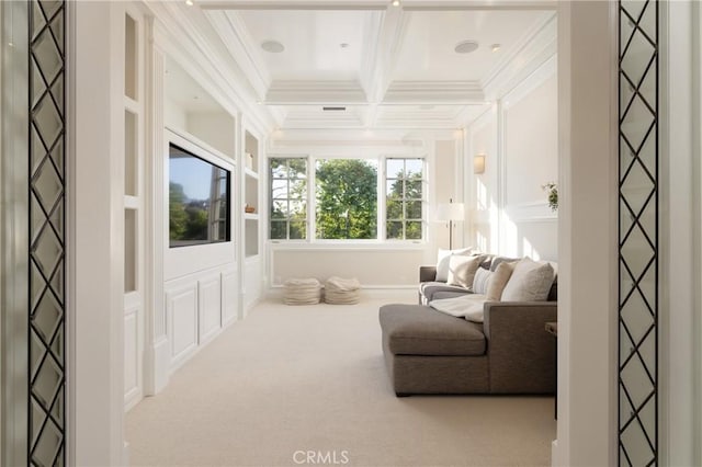 sitting room featuring crown molding, beamed ceiling, light colored carpet, and coffered ceiling