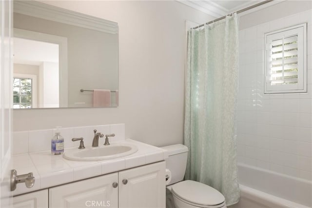 full bathroom with toilet, vanity, shower / tub combo, and ornamental molding