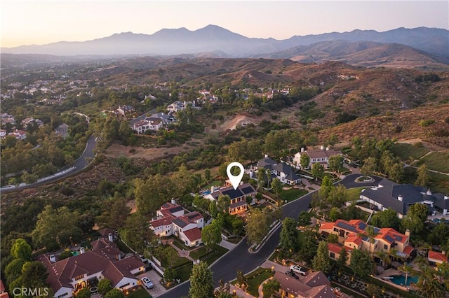 aerial view at dusk with a mountain view