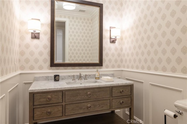 bathroom featuring vanity and ornamental molding