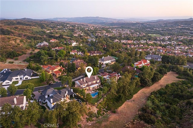 aerial view at dusk with a mountain view