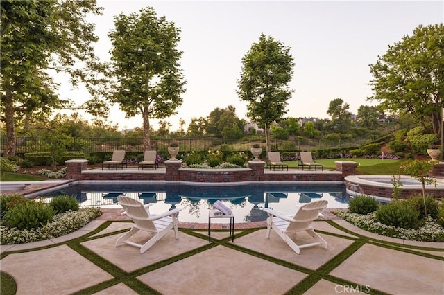 view of pool featuring a patio