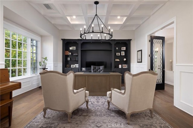 interior space with coffered ceiling, beamed ceiling, and dark hardwood / wood-style floors