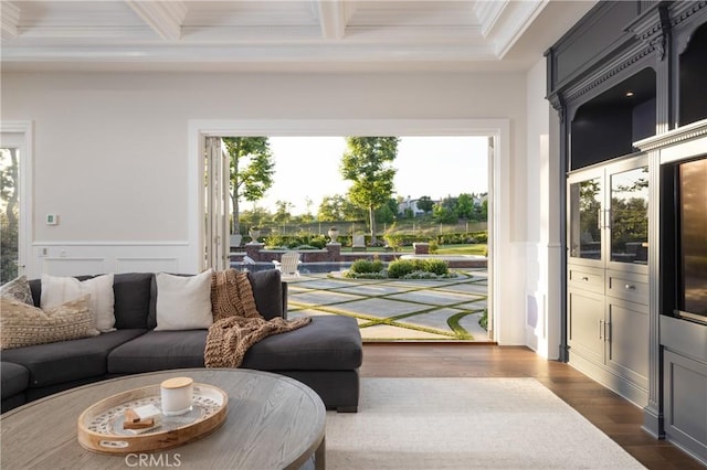 living room featuring beam ceiling, crown molding, dark wood-type flooring, and coffered ceiling