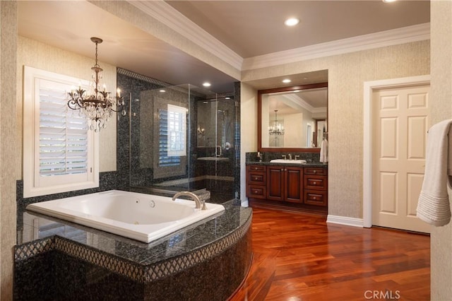 bathroom with separate shower and tub, a chandelier, wood-type flooring, vanity, and ornamental molding