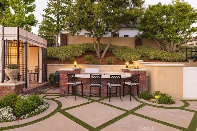 view of patio with exterior bar