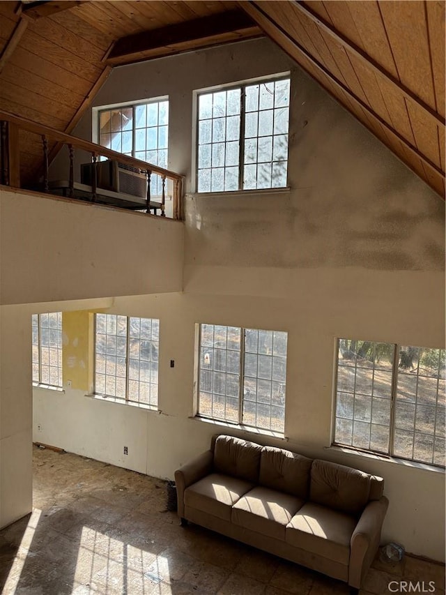 unfurnished living room with wooden ceiling and vaulted ceiling