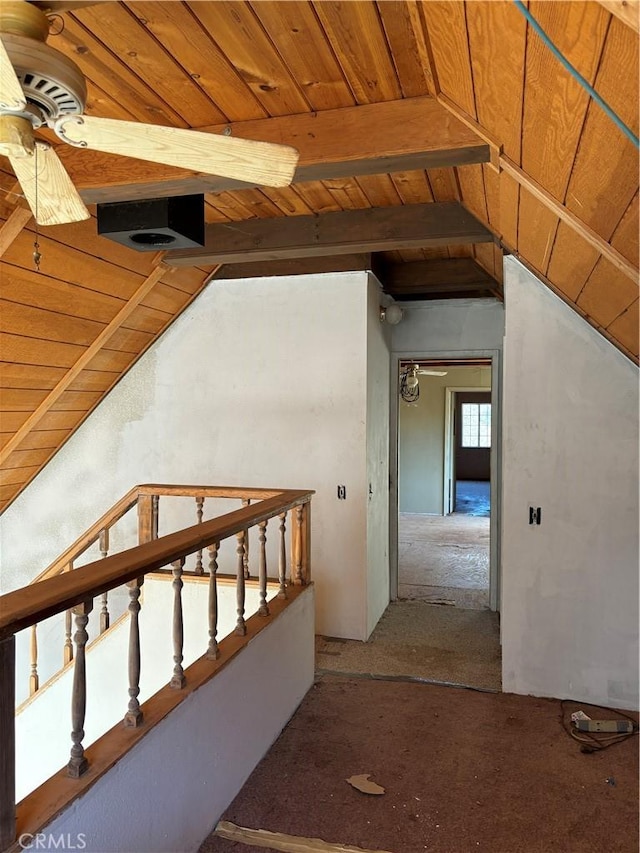 hall featuring vaulted ceiling with beams and wood ceiling