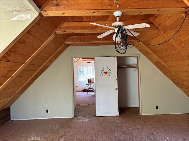 additional living space featuring ceiling fan and lofted ceiling