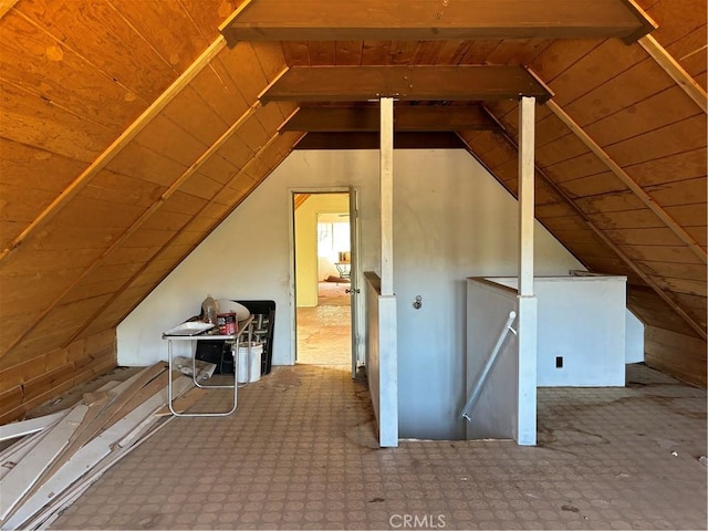 additional living space with vaulted ceiling with beams and wooden ceiling