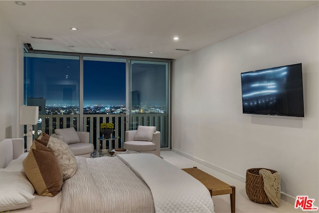 bedroom featuring a wall of windows