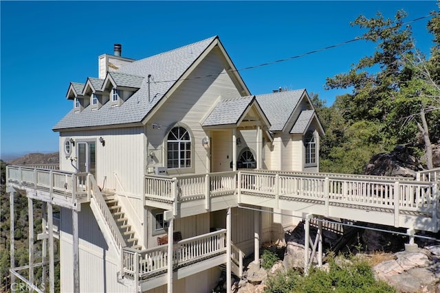 view of home's exterior with a wooden deck