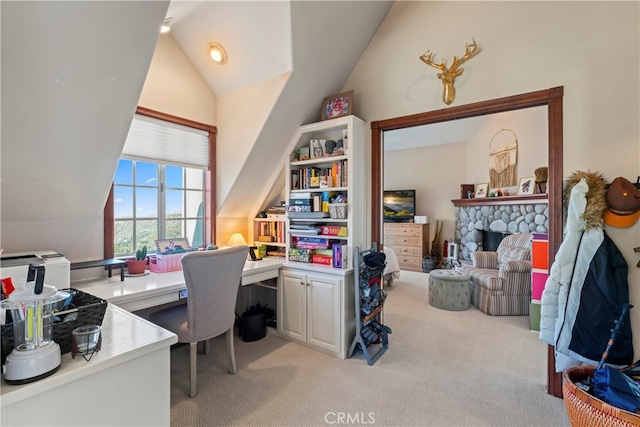 carpeted office featuring high vaulted ceiling