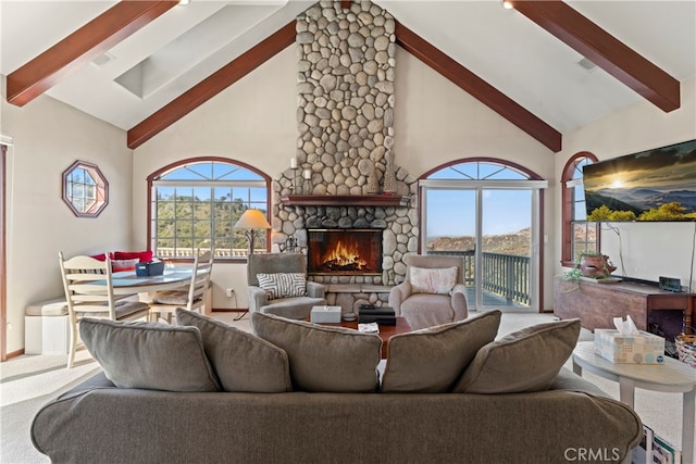 living room with a stone fireplace, beamed ceiling, carpet flooring, and high vaulted ceiling