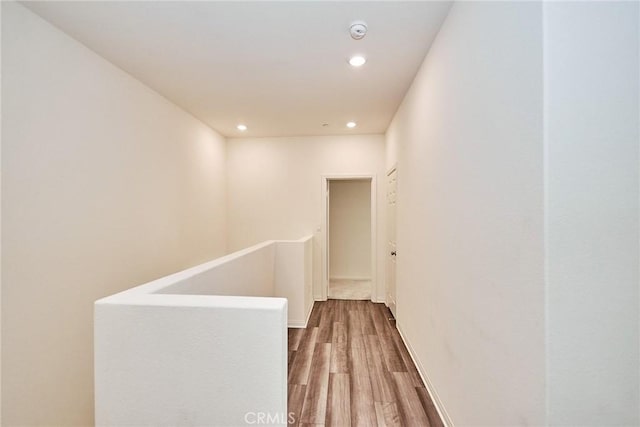 corridor with wood-type flooring