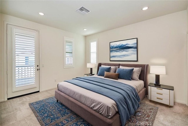 bedroom with light colored carpet and access to outside