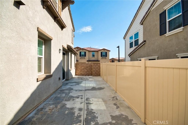 view of side of home featuring a patio