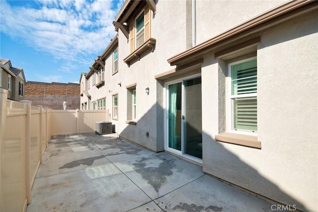 view of patio with central AC unit