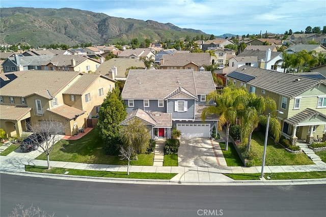 drone / aerial view featuring a mountain view