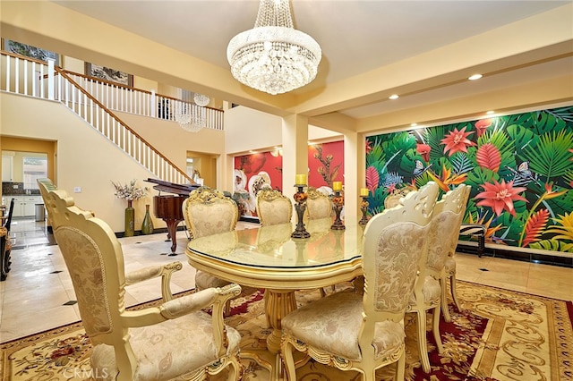 dining space with a chandelier and tile patterned floors