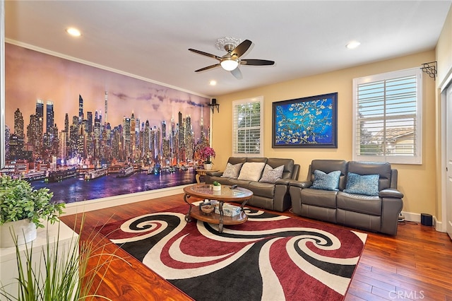 living room featuring a healthy amount of sunlight, crown molding, hardwood / wood-style floors, and ceiling fan