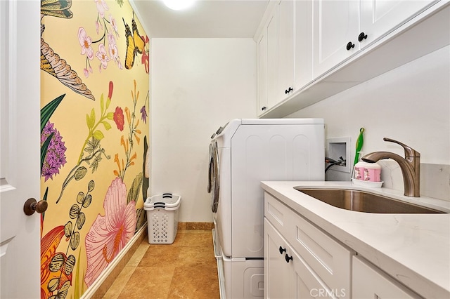 laundry room with sink, washer / dryer, and cabinets