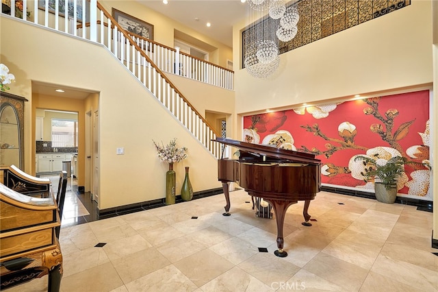 miscellaneous room featuring a towering ceiling