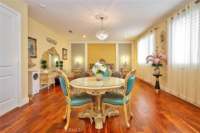 dining room featuring a chandelier and dark hardwood / wood-style flooring