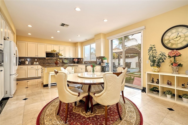 dining space with light tile patterned floors