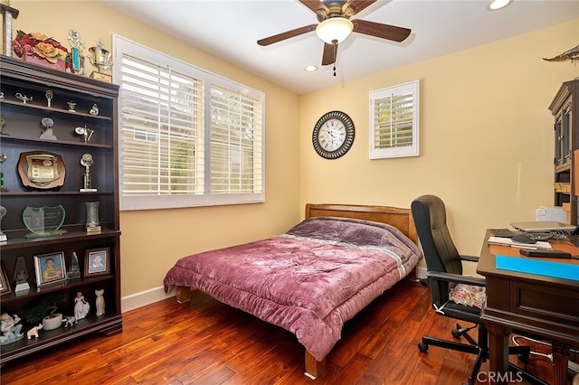 bedroom featuring ceiling fan and dark wood-type flooring