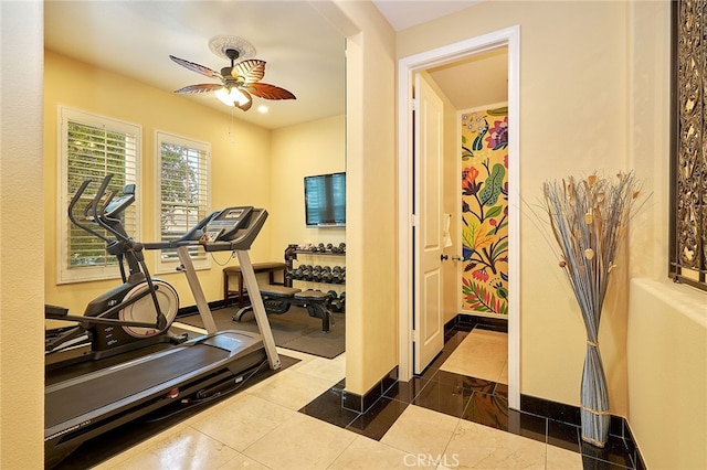 exercise room with ceiling fan